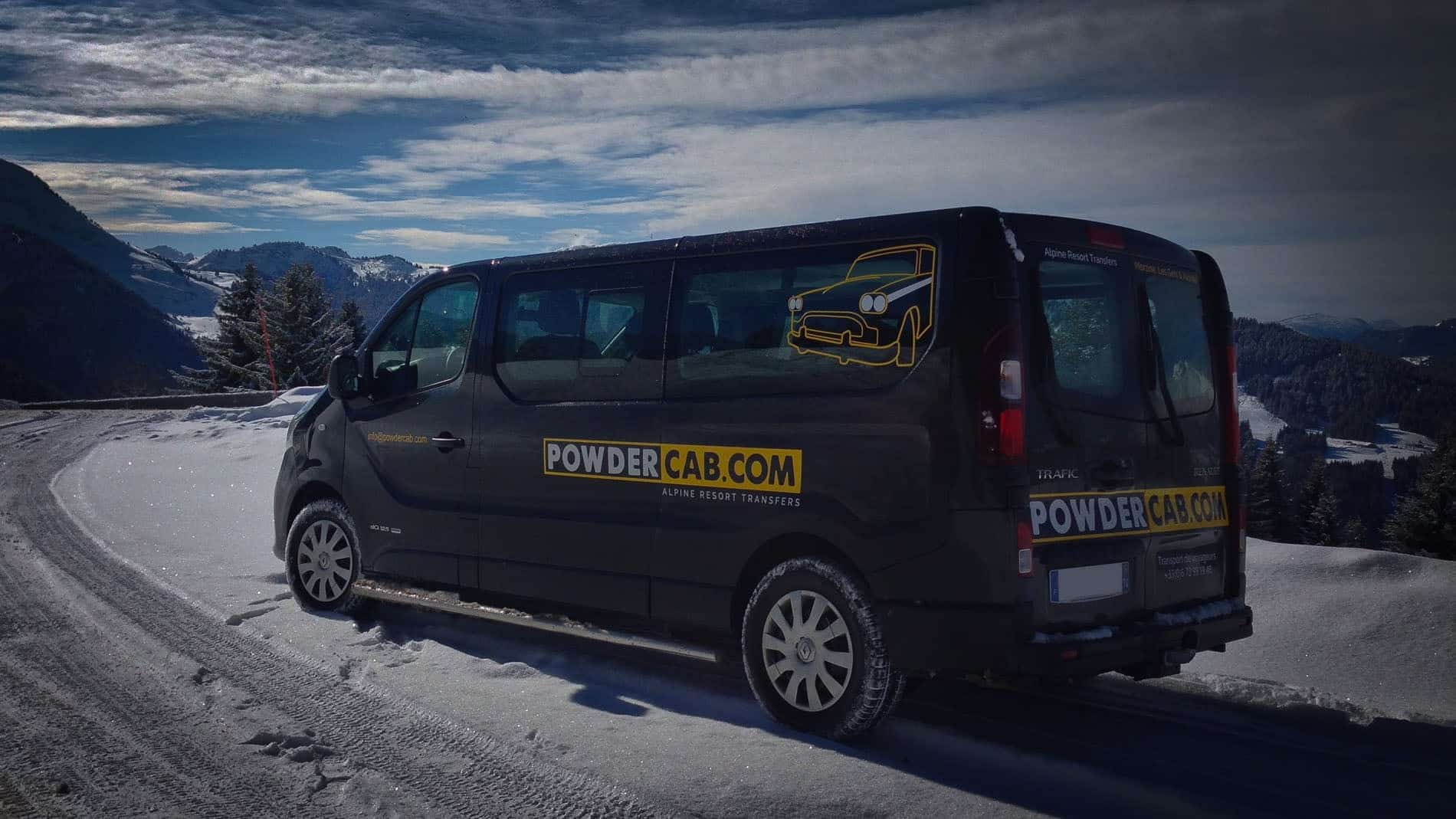 PowderCab minibus on a snowy mountain road